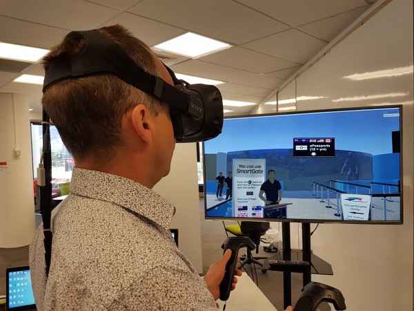 Person using a VR headset and taking part in Customs simulation.